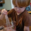 Young Child is Stirring the Slime Mixture