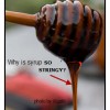 Syrup is Dripping from a Wooden Stirring Tool Dripping Syrup