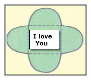 A stick-on label with a message is placed in the center of a paper flower.